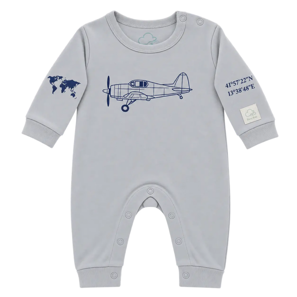 A light gray baby long-sleeve romper with a navy blue airplane graphic on the chest, a world map on one sleeve, and coordinates on the other sleeve, shown on a plain white background.
