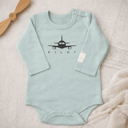 Sage green long sleeve baby bodysuit with PILOT graphic, lifestyle view – Kumy Kids