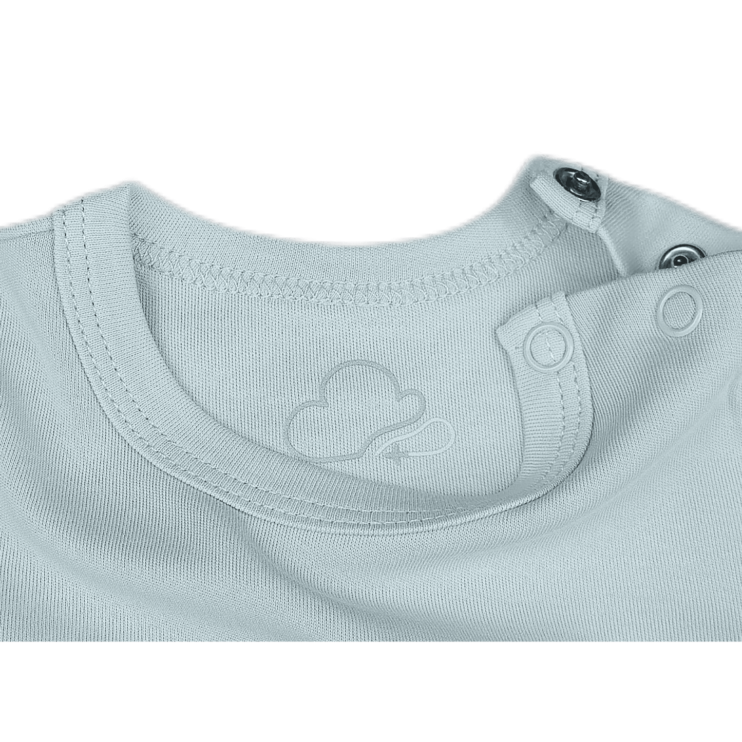 Close-up of a light gray baby outfit with a brand logo on a green background