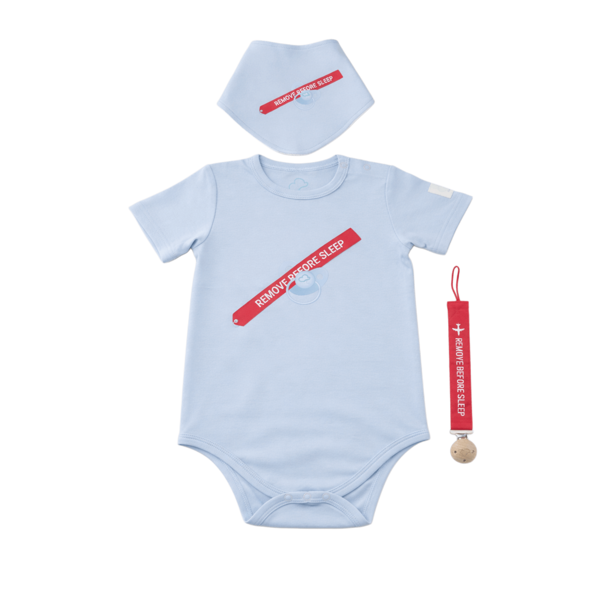 Baby onesie, bib, and teether set with 'Remove Before Sleep' text