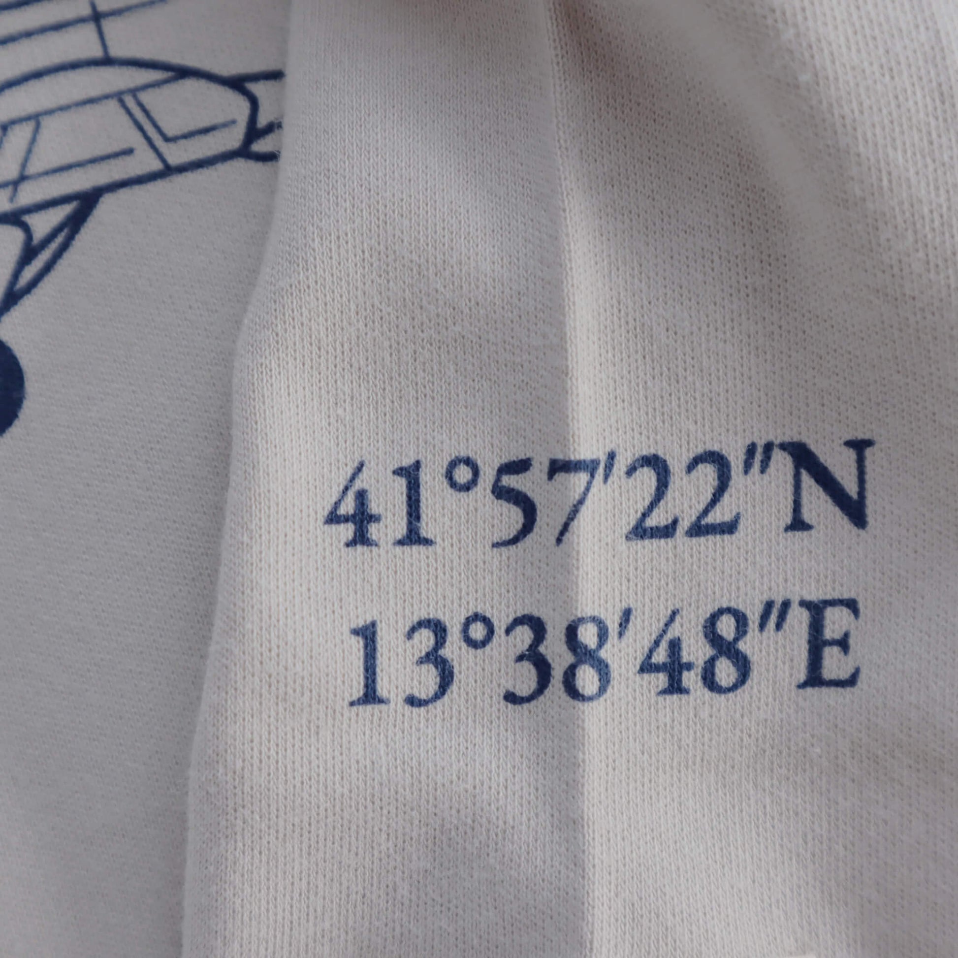 Grey aviation baby romper, flight coordinates print detail