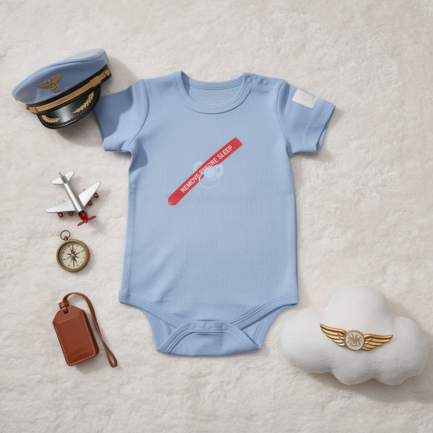 Kumy Kids aviation babywear storytelling image with baby bodysuit in soft nursery setting